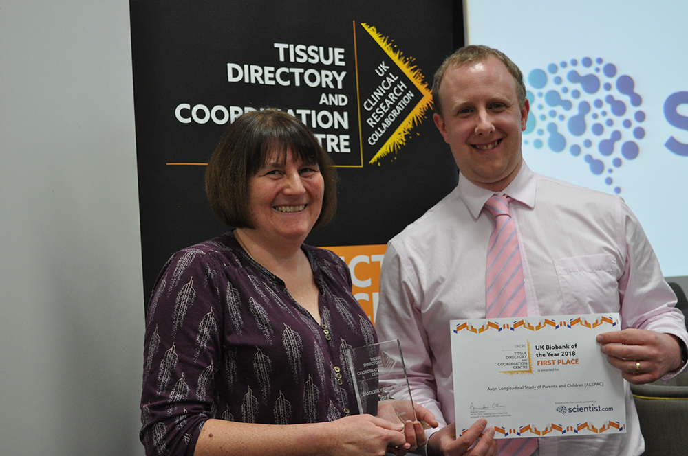 SRing_PQuinlan Sue Ring and Phil Quinlan posing with award and certificate