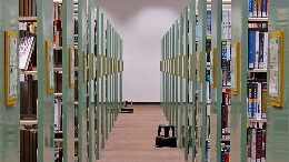 An aisle of shelves filled with books