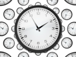 An image of a black and white clock face with many smaller clock faces in the background, all showing the time as 1.55.