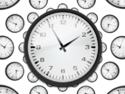 time-430625_640 (2) (1) An image of a black and white clock face with many smaller clock faces in the background, all showing the time as 1.55.